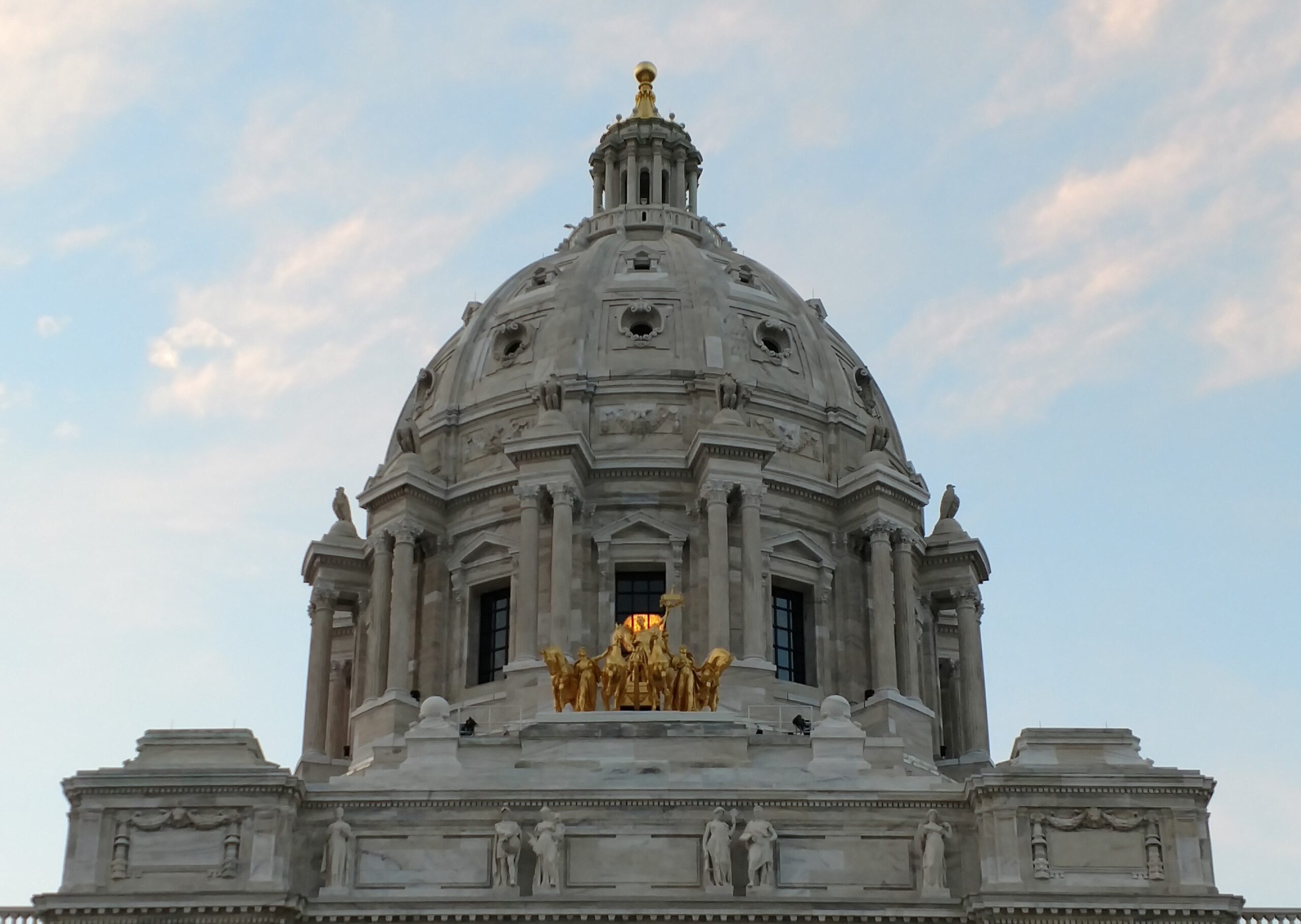 Dome of Minnesota State Capitol with lit chandelier inside